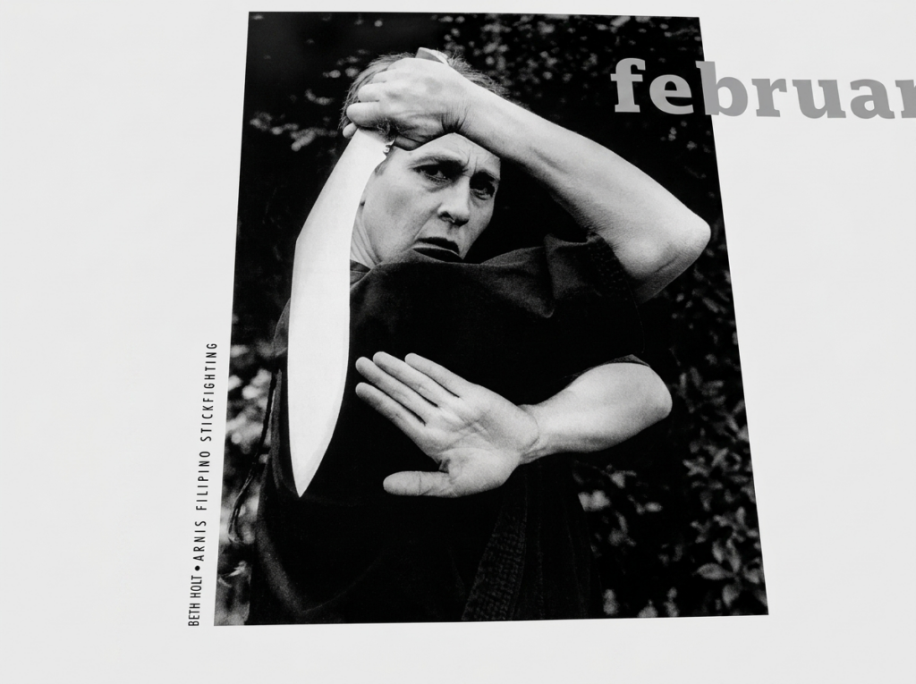 Beth Holt demonstrating Arnis Filipino stick fighting in archival black and white