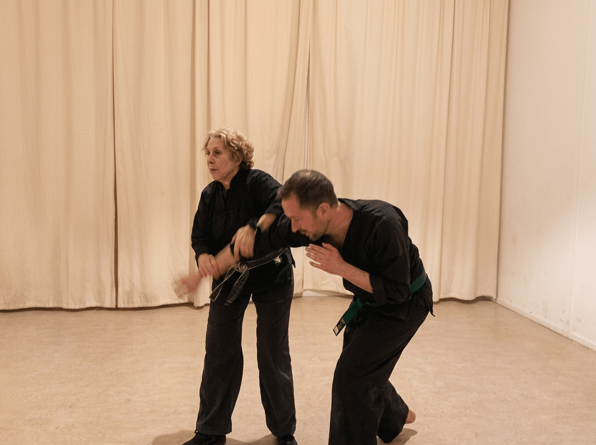 Beth Holt practicing Arnis joint lock self defense technique with student, Kawayan Martial Arts School Netherlands